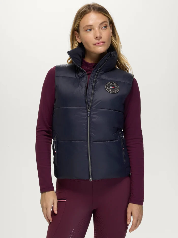 Woman wearing Tommy Hilfiger Everett Puffer Gilet in Desert Sky
