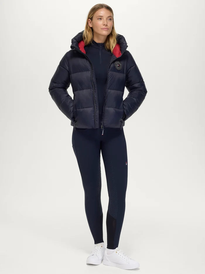 Woman wearing Tommy Hilfiger Women's Glendale Puffer Jacket in Desert Sky